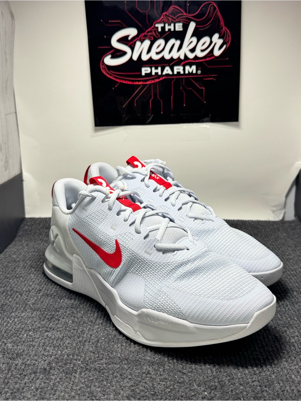 Nike White Sneakers with Red Swoosh Accent